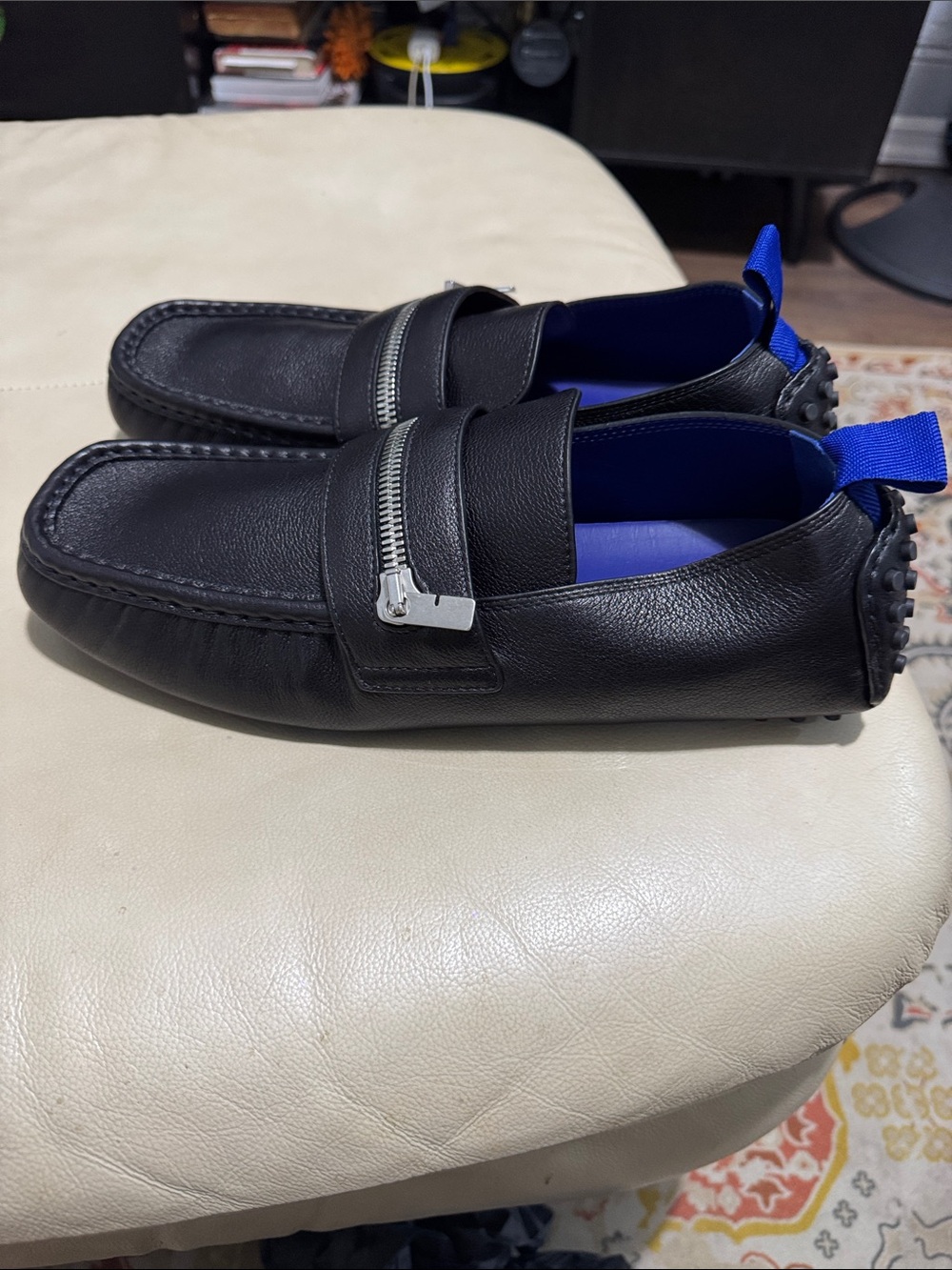 Burberry Black Leather Slip-On Loafers with Blue Interior and Silver Zip.